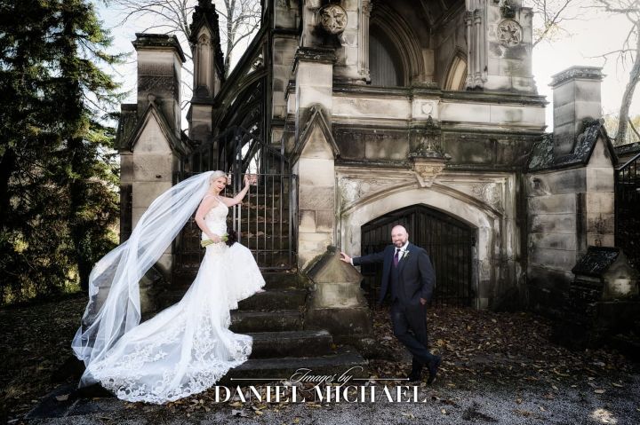 Wedding photography of bride and groom near old building